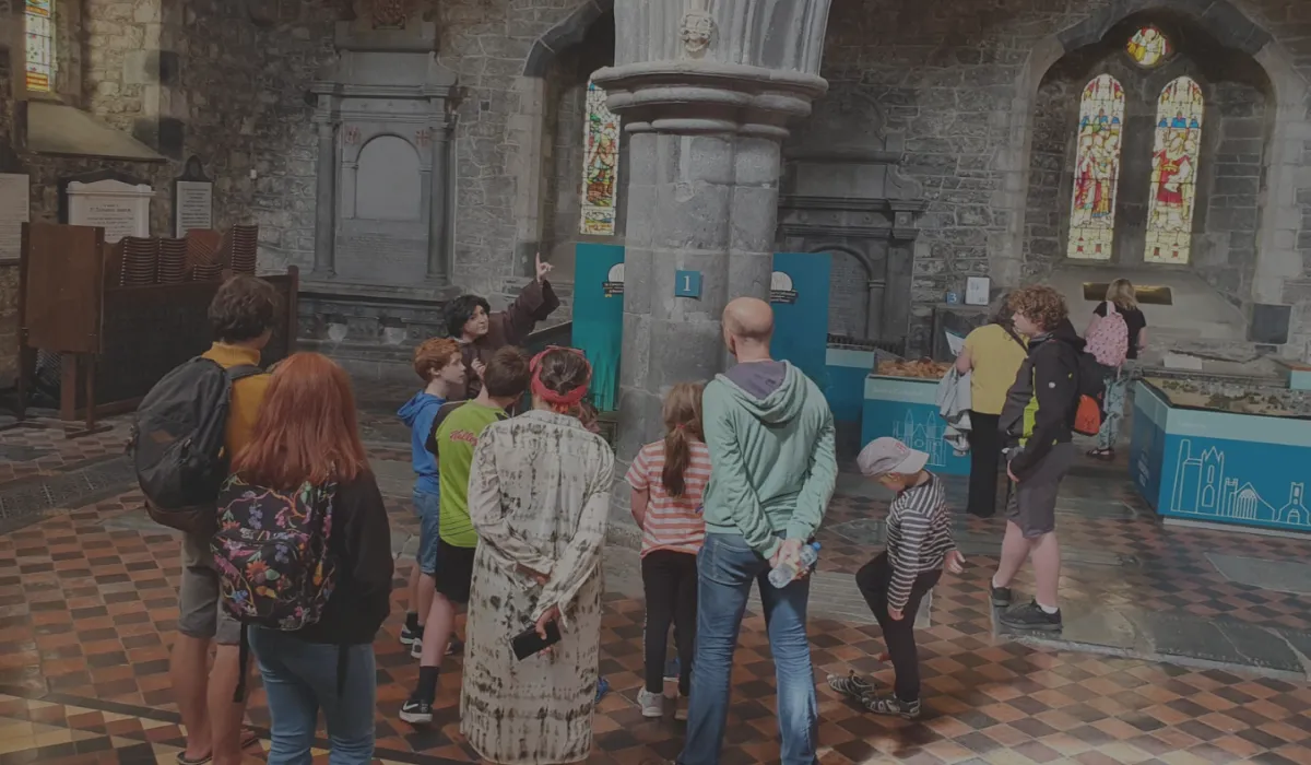 Students participating in a school tour at St. Canice's Cathedral, exploring its history and architecture.