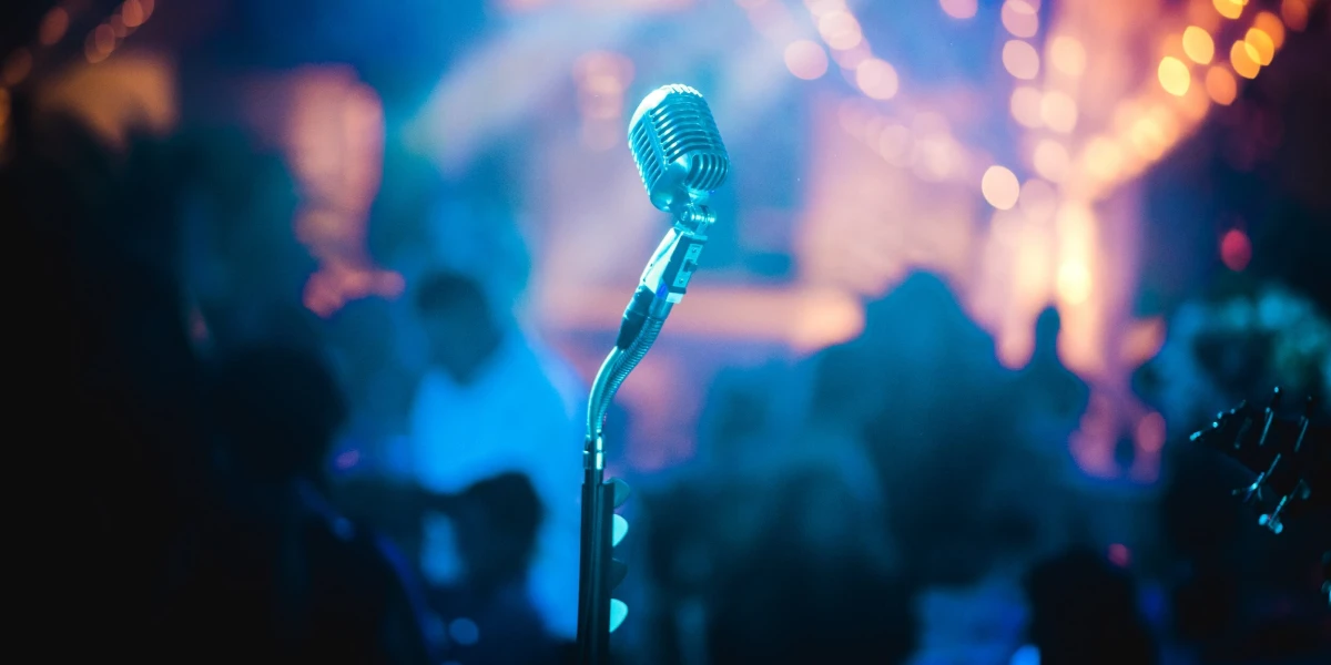 Close-up of a microphone, symbolizing audio or speaking events, such as talks, performances, or broadcasts